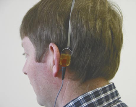 A man wearing hearing test equipment