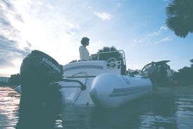 A boat with a single Evinrude E-TEC outboard engine