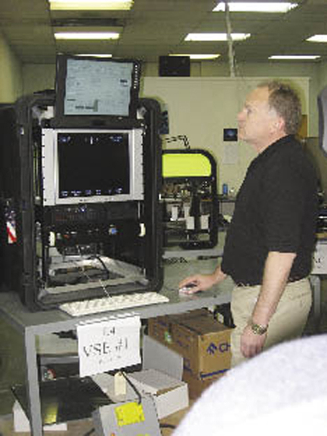 A Deep Ocean Engineering scientist operates the underwater system.