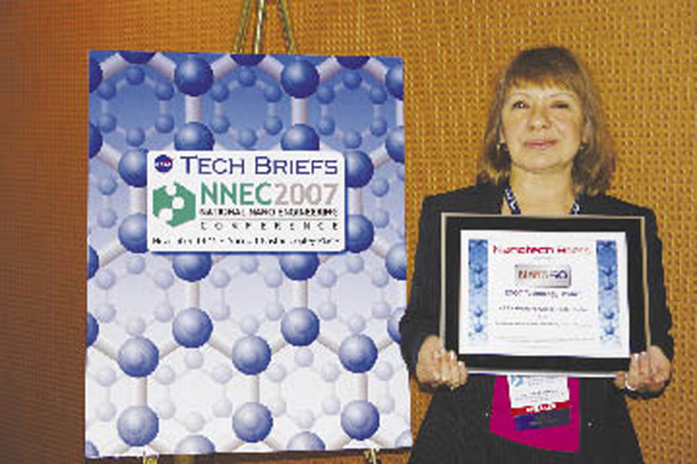 Jeannette Benavides holds her Nano 50 award.