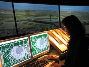 A computer specialist examines airport ground traffic.