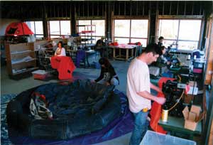 Workers at Givens Marine Survival Company assemble life rafts.