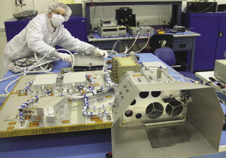 A worker assembling electronics for the LCROSS mission A worker assembling electronics for the LCROSS mission