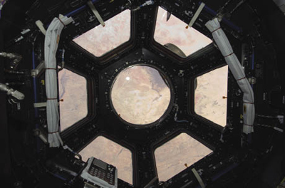 View from the cupola windows of the International Space Station View from the cupola windows of the International Space Station
