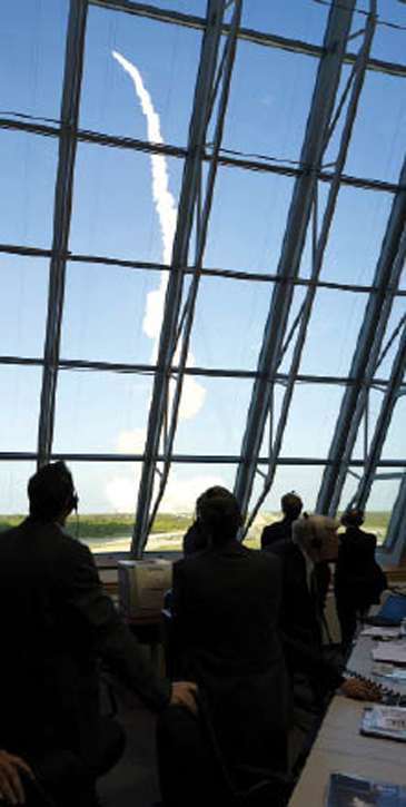 NASA staff watching space shuttle launch NASA staff watching space shuttle launch