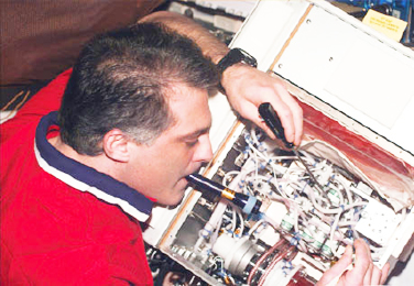 Astronaut with a bioreactor unit Astronaut with a bioreactor unit