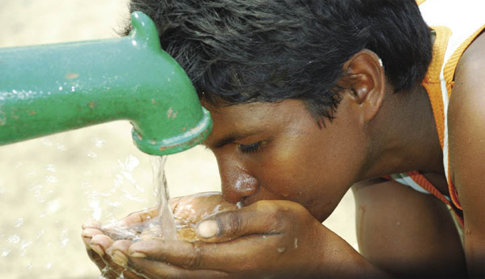 Child drinking water from faucet Child drinking water from faucet