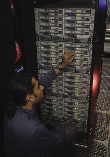 Engineer adjusting hardware Engineer adjusting hardware
