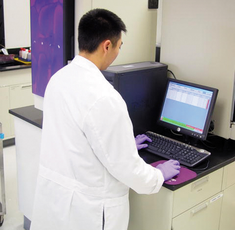 A Biolog laboratory technician performs cellular tests