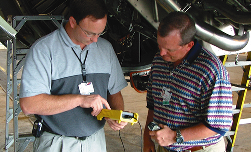 Delta Airline technicians Dane Swenson and Jim Elick use the Eclypse analyzer to test generator feeders on a Boeing 767 commercial aircraft
