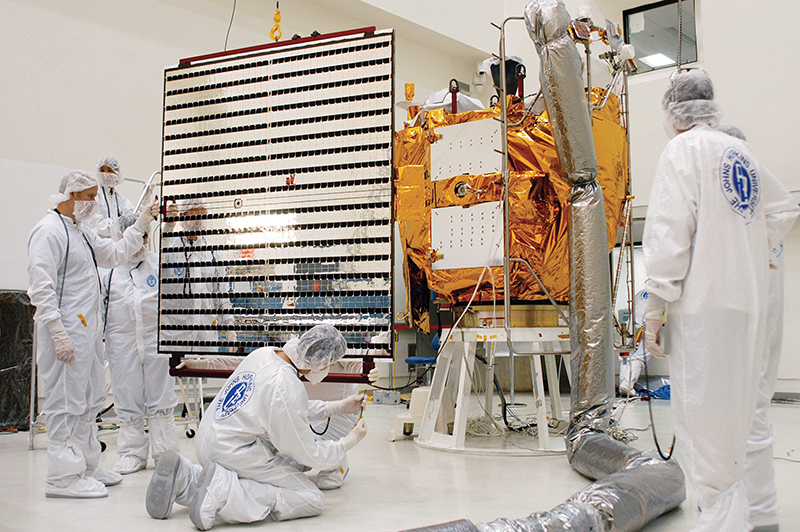 Technicians working on the MESSENGER spacecraft