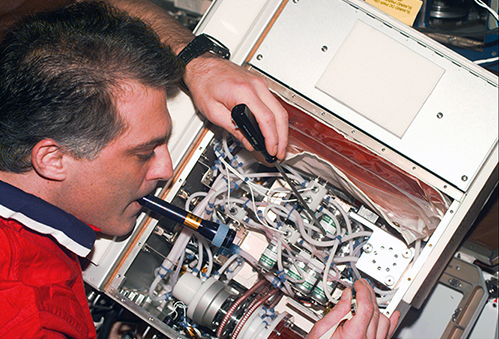 Astronaut with a bioreactor unit