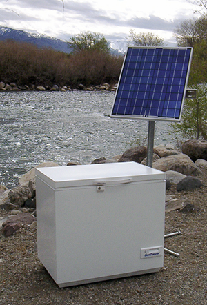 SunDanzer solar-powered refrigerator outside in cloudy weather