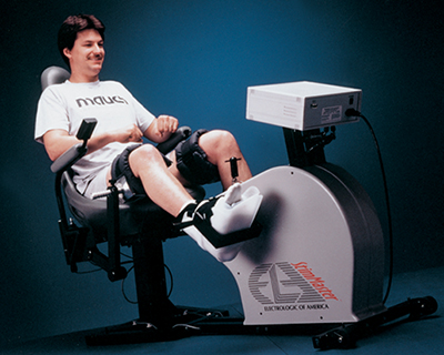 A man exercises on a device that stimulates muscles suffering from paralysis