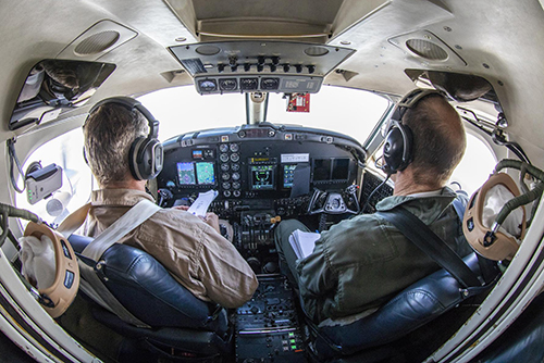NASA pilots Peter Coen and Wayne Ringelberg in the B200 King Air cockpit