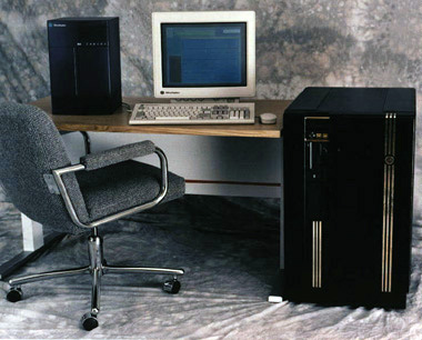 A computer simulation processor pictured against a smaller computer workstation to show scale