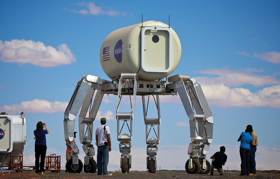 Observers take pictures of NASA’s ATHLETE freight-carrying robot