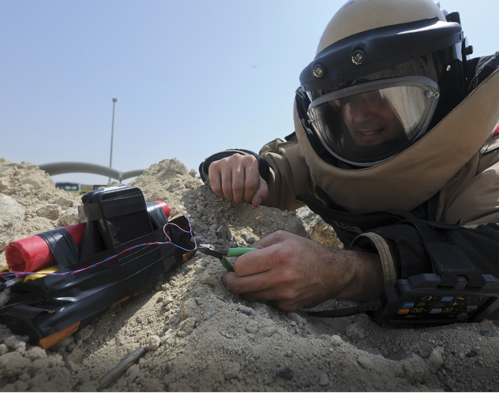 An explosive ordnance disposal worker diffuses a bomb