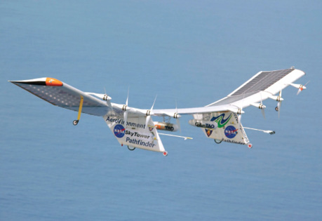 The Pathfinder Plus solar-powered, unmanned aircraft flies over the ocean