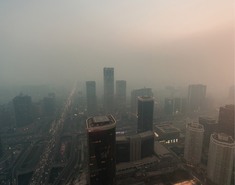 An overhead view of a smog-filled cityscape in China