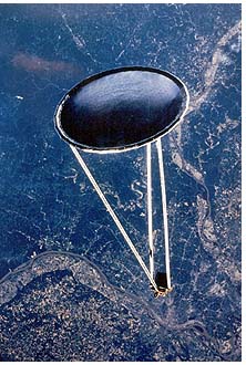 photograph of a large inflatable space antenna the Spartan 207 pictured above Saint Louis and the Mississippi River