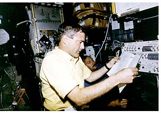 astronaut checks the audio system of the SPACEHAB laboratory