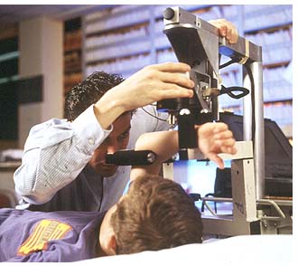 A technician uses the Mechanical Response Tissue Analyzer to achieve bone flexibility measurements