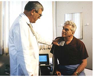 photograph of a physician checking a patient's advanced Trilogy pacemaker