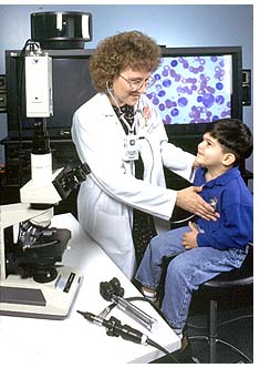 A doctor transmits the sounds of a child's heart to another doctor 250 miles away