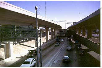 of road monitoring camera mounted on a pole overlooking a road and a bypass