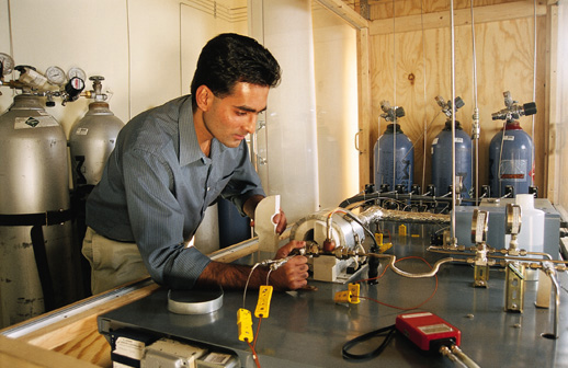 engineer works with a test rig to simulate automotive exhaust gas