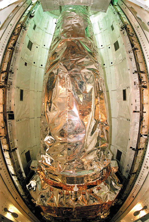 Chandra x-ray observatory resting inside the payload bay of the orbiter Columbia
