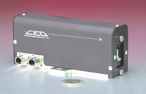 Cutting Edge Optronics's slab pumphead, the Whisper Minislab next to a quarter to show dimensions