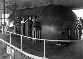 NACA staff members conduct tests on airfoils in wind tunnel