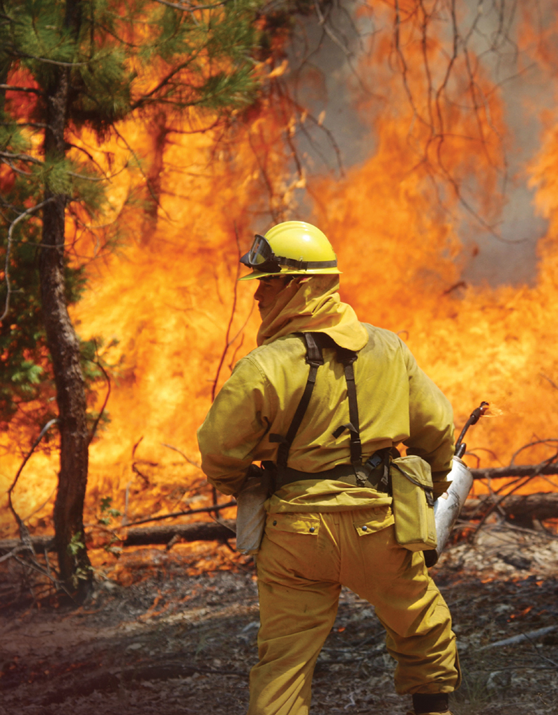 A firefighter battles a fire