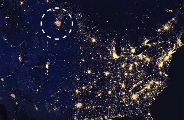 Map of the United States at night with a circle around gas flares from North Dakota drilling operations