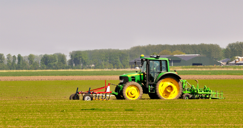 john deere tractors in field