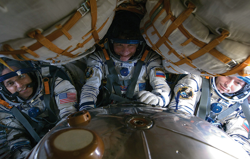 From the left: Astronaut Joe Acaba and Russian cosmonauts Gennady Padalka and Sergei Revin aboard the Soyuz spacecraft