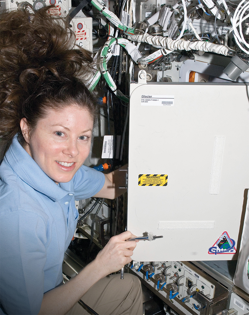 Astronaut Tracy Caldwell Dyson with cryocooler