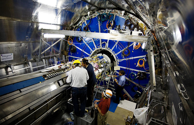 Scientists examine the Large Hadron Collider