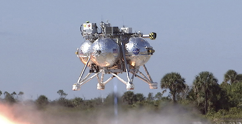 Prototype lunar lander Morpheus hovers above the ground during a test flight