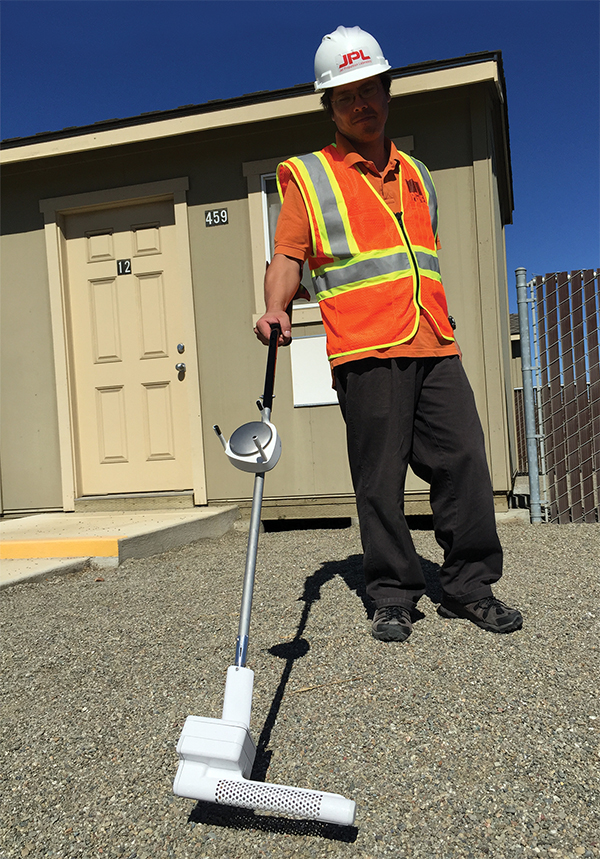 Scientist with methane sensor