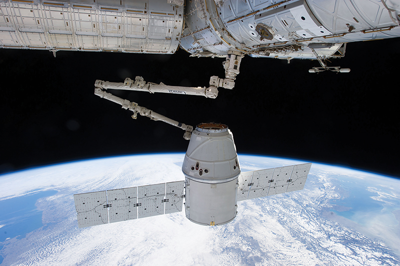 ISS robotic arm grapples satellite