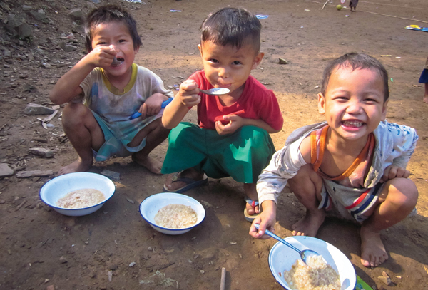 Children eating rice