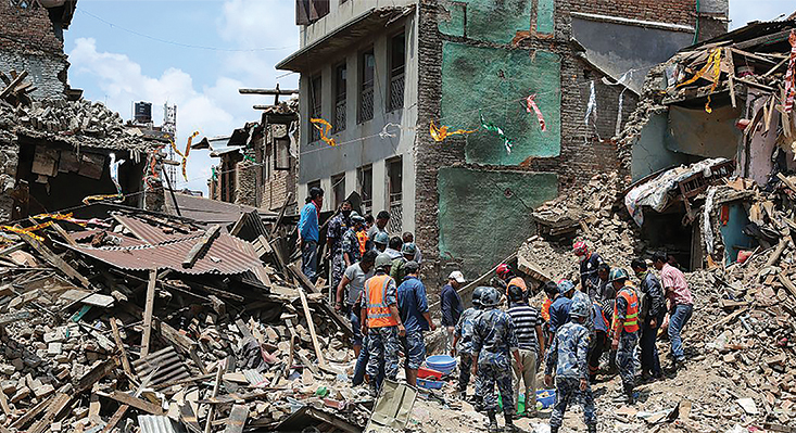Rescue workers examine wreckage after an earthquake