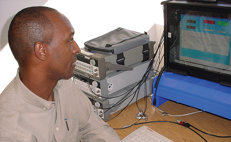 An engineer works on a computer that provides air data for air vehicles