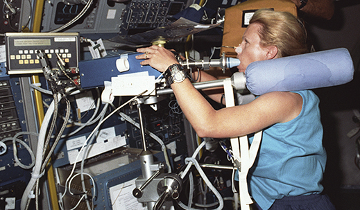 Astronaut Rhea Seddon performs cardiovascular experiments in space.