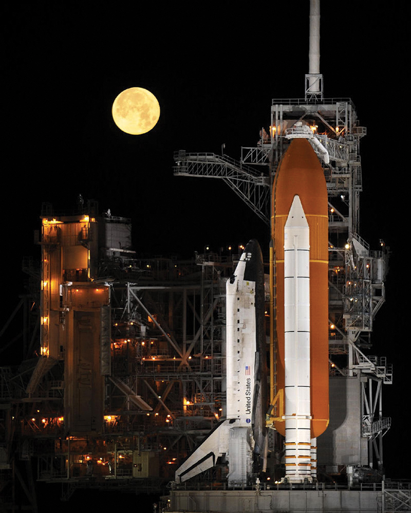 A space shuttle prepares for a night launch.