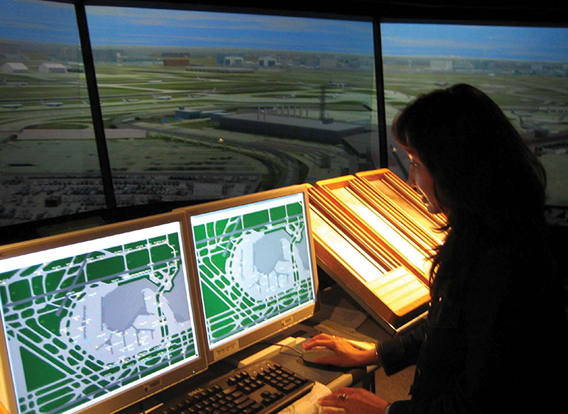 A computer specialist examines airport ground traffic