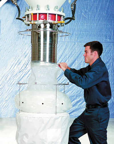 A technician works with the DoverPac system